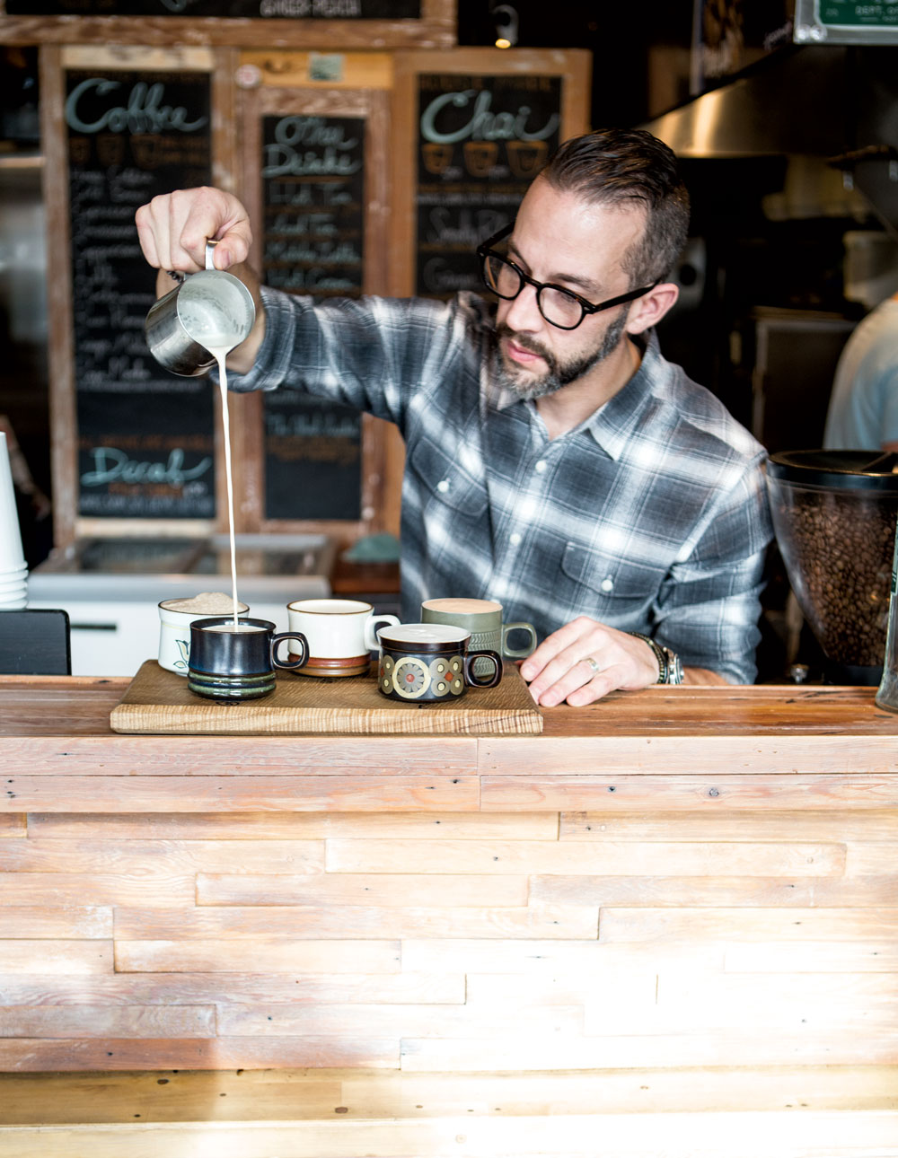 Nate Snell, who owns Pip's Original with his wife, Jamie, pours a chai flight at the Portland café. (Photos: Cory Eldridge.)