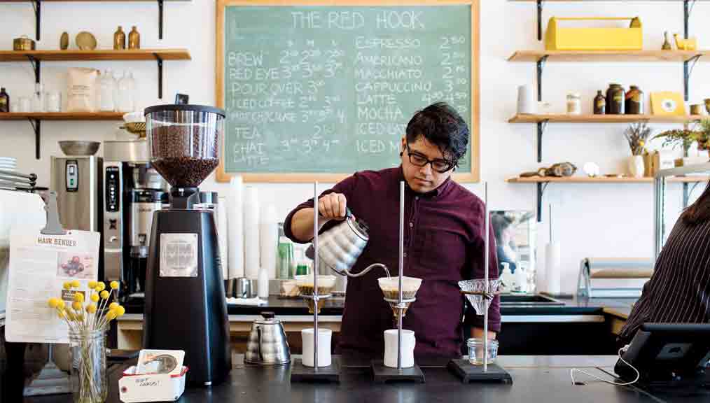 A barista makes a pour-over at the Red Hook in Ferndale, a Detroit suburb. (Photo: Chris and Michelle Gerard.)